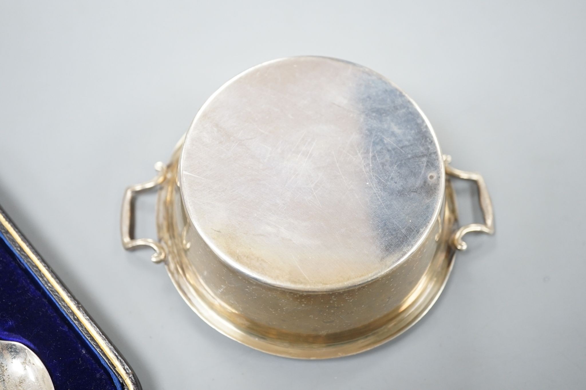 A set of six silver teaspoons, a silver two handled small butter dish, with glass liner and silver mounted cut glass toilet jar.